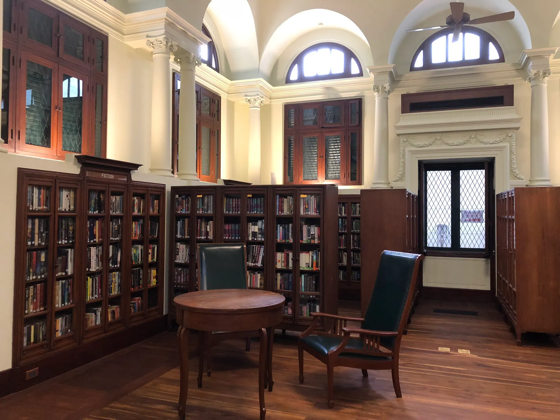 Book shelves and a reading chair inside the Neilson Hays Library