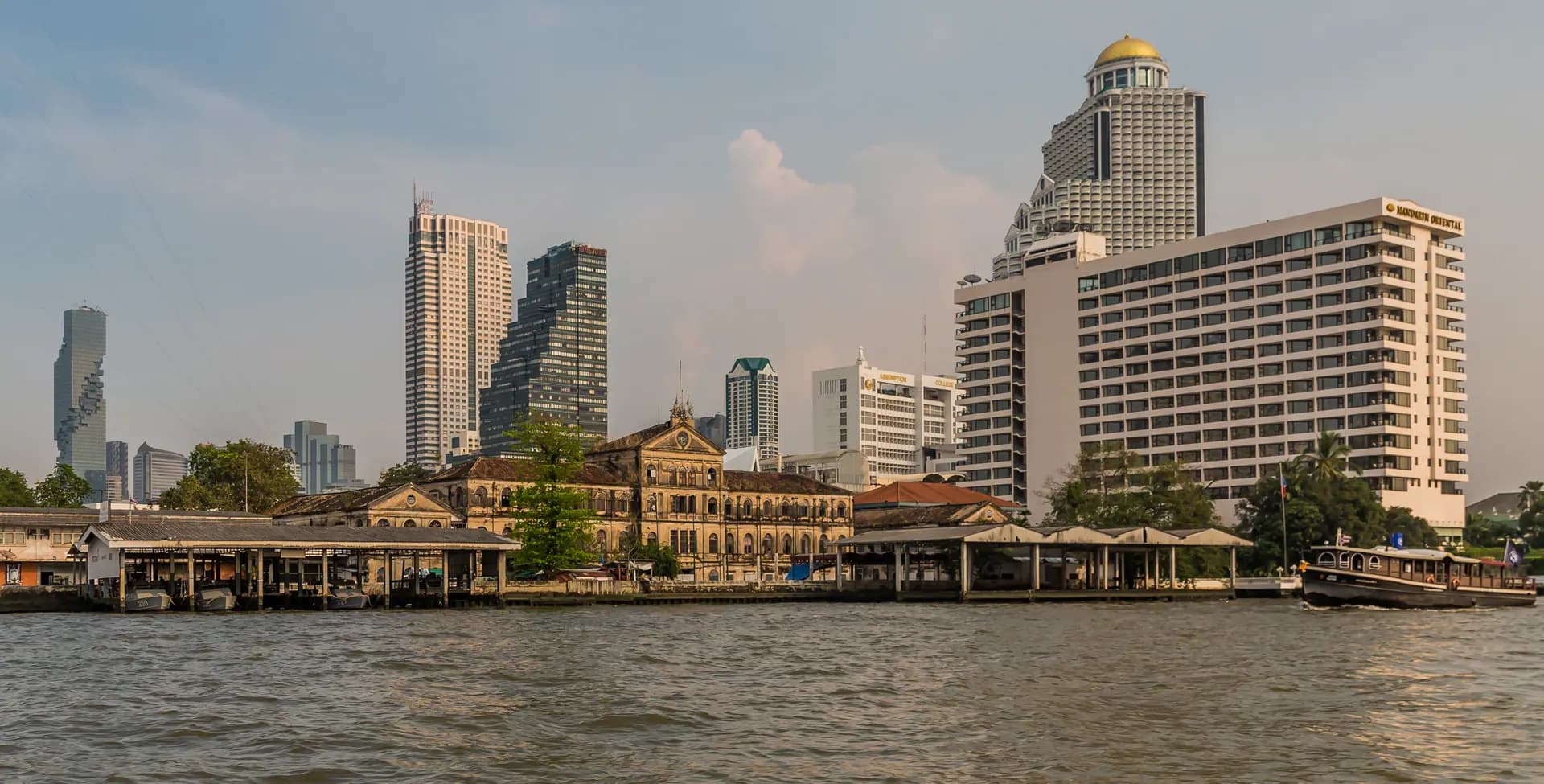 The Old Customs House on the Chao Phraya River with the Oriental Hotel beside it