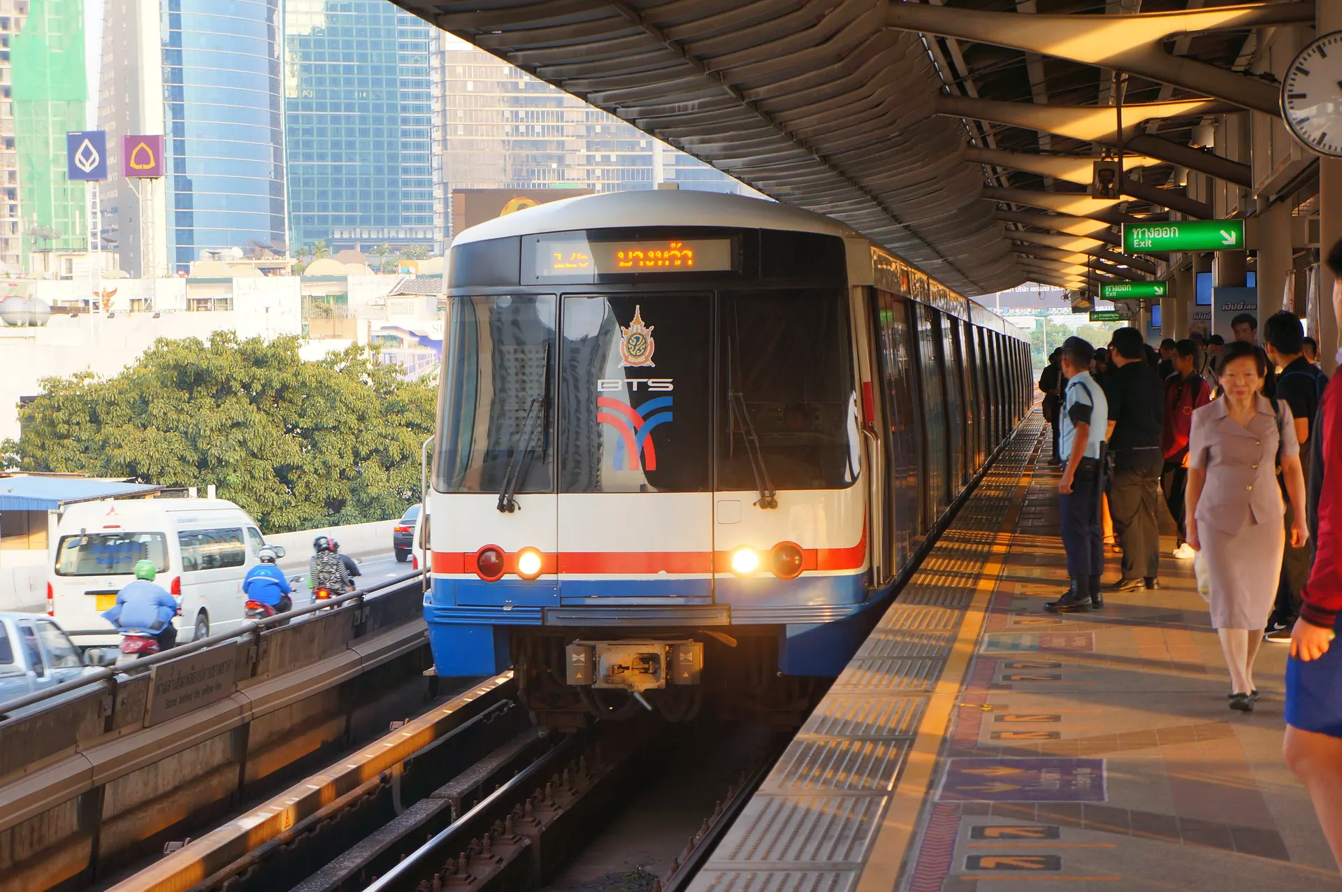 A BTS train arriving at the Saphan Taksin station platform