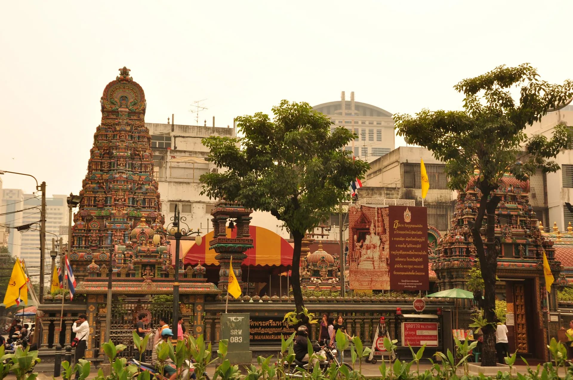 The carved gateway tower of the Sri Maha Mariamman Temple rising above the street corner in Silom