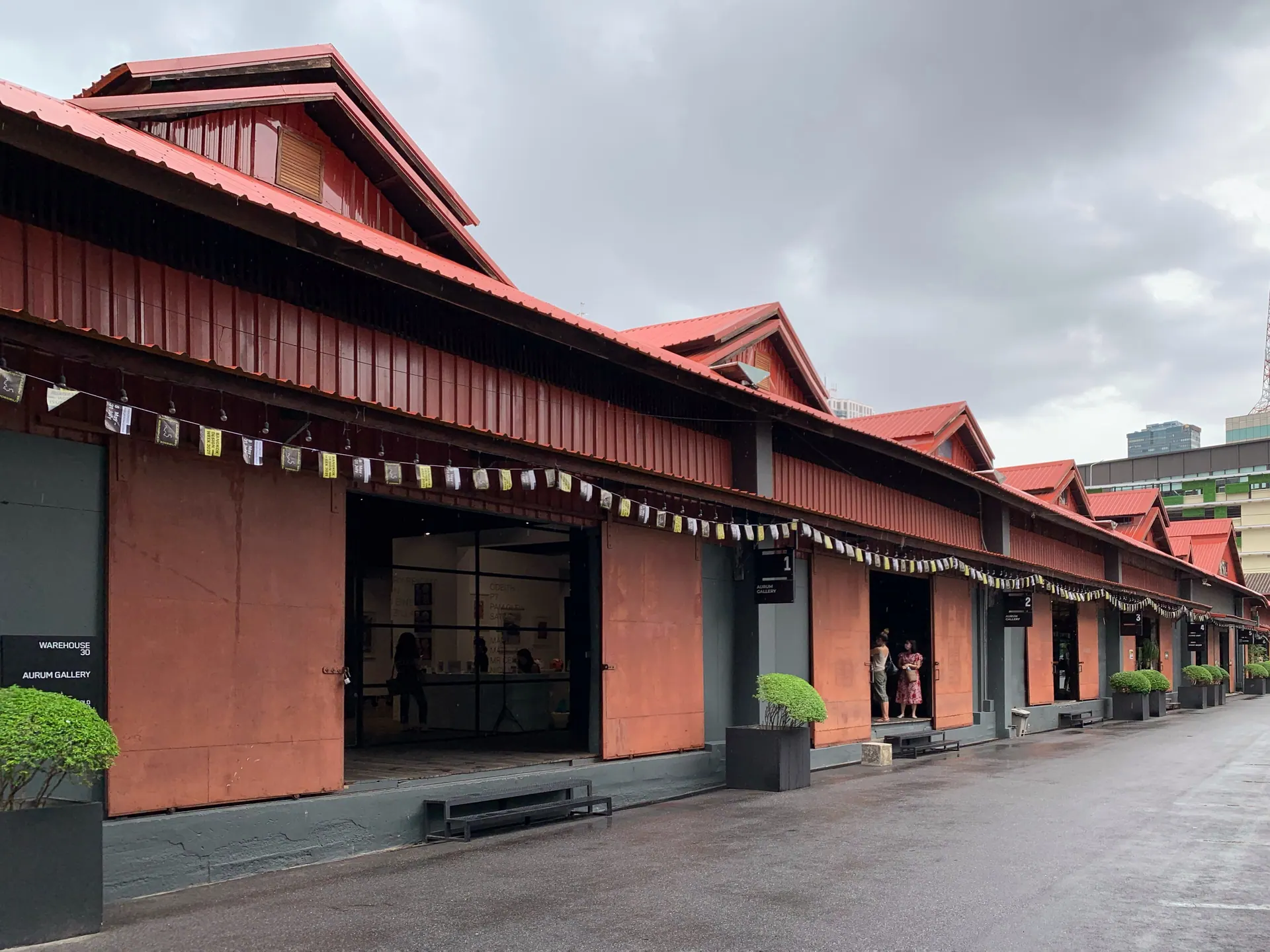 The long red-roofed warehouse buildings of Warehouse 30 on Charoen Krung