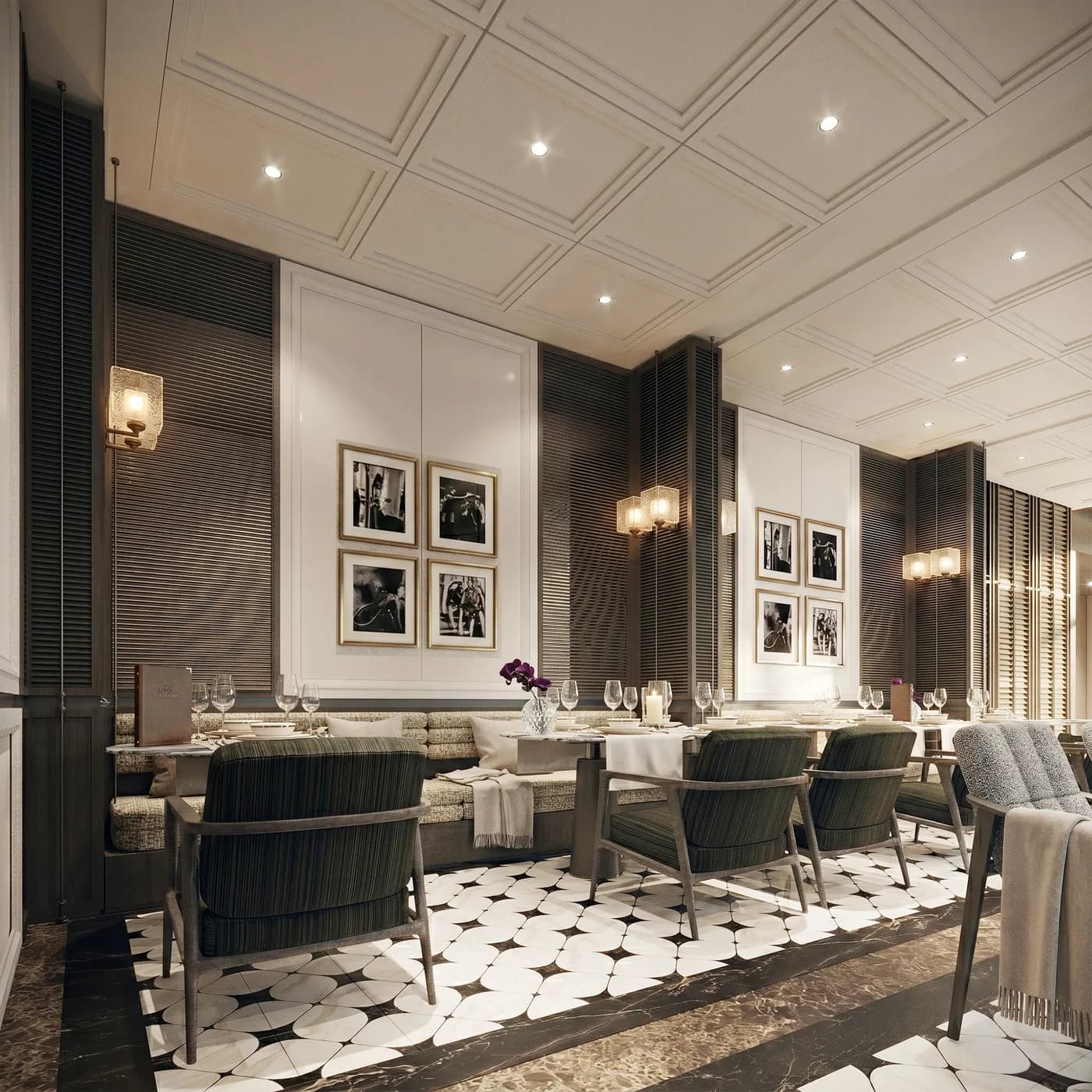 Green banquette seating beneath framed monochrome prints in the restaurant