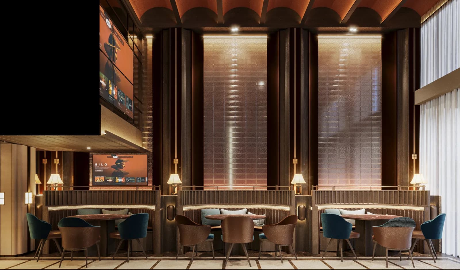 Lounge seating with round tables and blue chairs in front of tall fluted screens