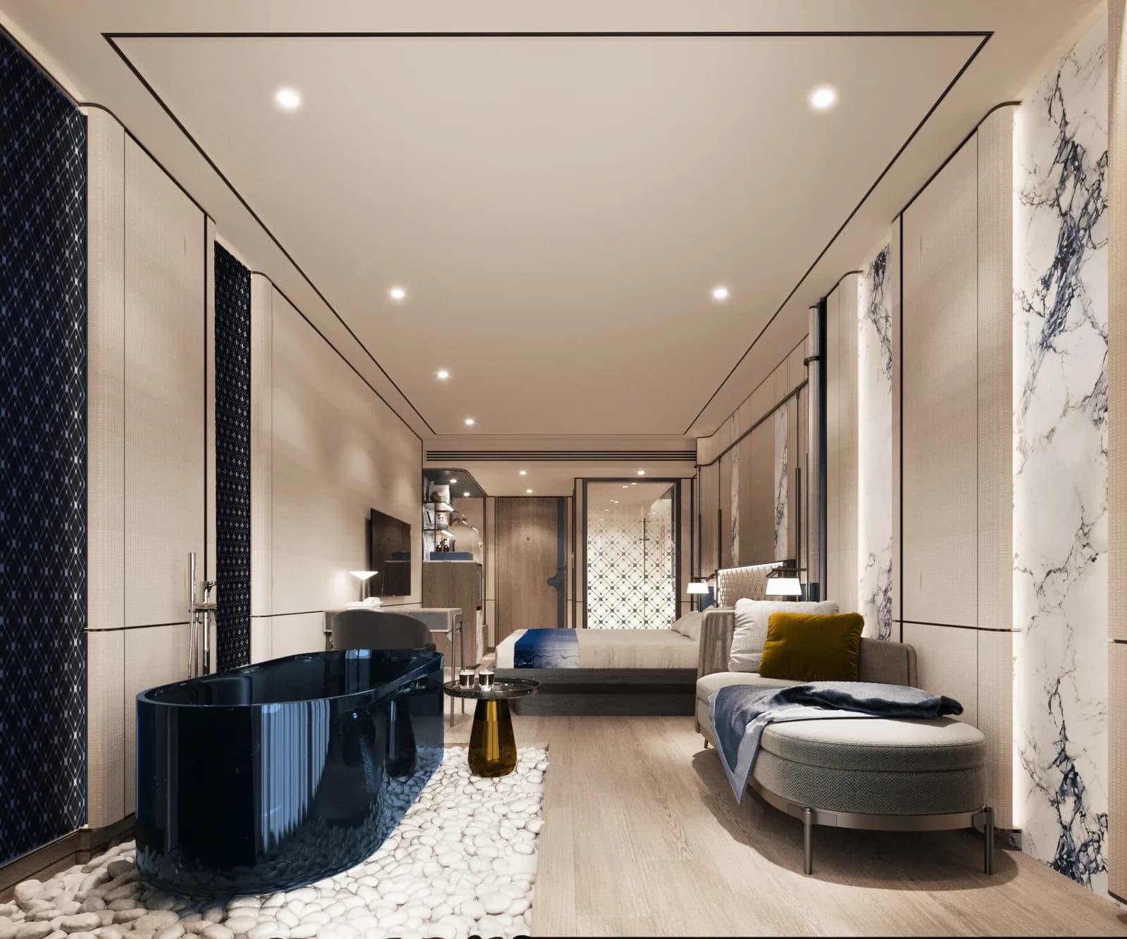 Suite interior with a freestanding navy bath, blue lounge seating and veined marble wall panels