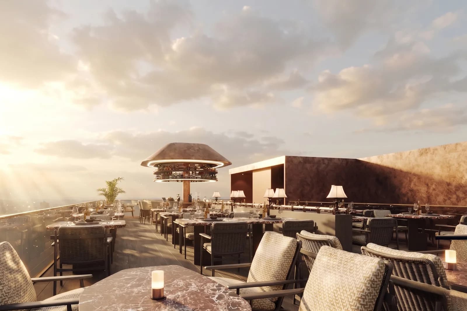 Rooftop terrace at sunset with low seating, planters and a canopied bar structure
